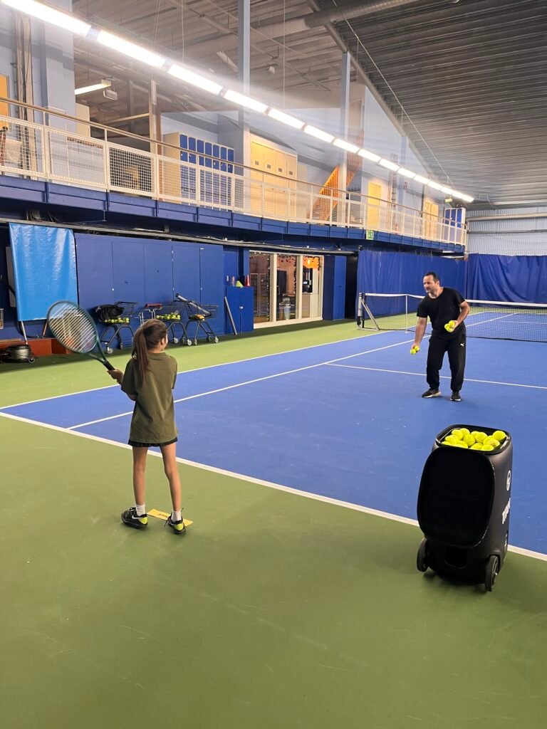 Luna hitting backhand